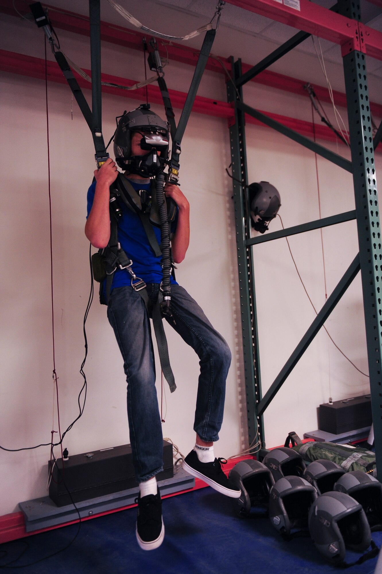 Jonathan Dase experiences a virtual simulation of an aircraft ejection during his visit to Seymour Johnson Air Force Base, North Carolina, on Sept. 23, 2014. The 334th Fighter Squadron hosted Dase as part of their Pilot for a Day program. Dase suffers from a rare eye condition called keratoconus, which will prevent him from living out his dream of joining the Air Force. (U.S. Air Force photo/Airman 1st Class Brittain Crolley)