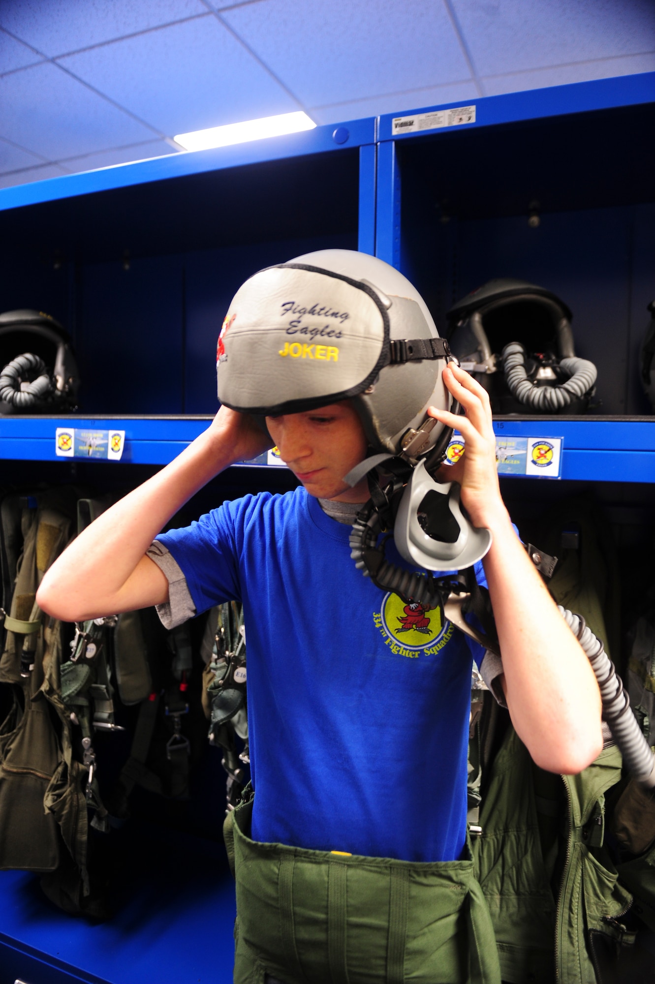 Jonathan Dase dons a flight suit and helmet during his visit to Seymour Johnson Air Force Base, North Carolina, on Sept. 23, 2014. The 334th Fighter Squadron hosted Dase as part of their Pilot for a Day program. Dase suffers from a rare eye condition called keratoconus, which will prevent him from living out his dream of joining the Air Force. (U.S. Air Force photo/Airman 1st Class Brittain Crolley)