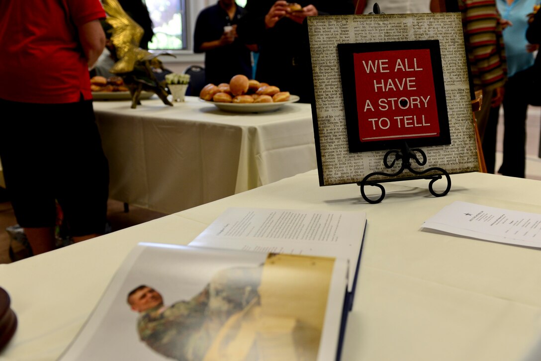 A remembrance table was used to display images of fallen during the Gold Star Mother’s Day ceremony and candle-lighting at the Regimental Memorial Chapel at Fort Eustis, Va., Sept. 28, 2014. The observance day was created in 1936 to honor the mothers of fallen Service members. (U.S. Air Force photo by Airman 1st Class Kimberly Nagle/Released)  
