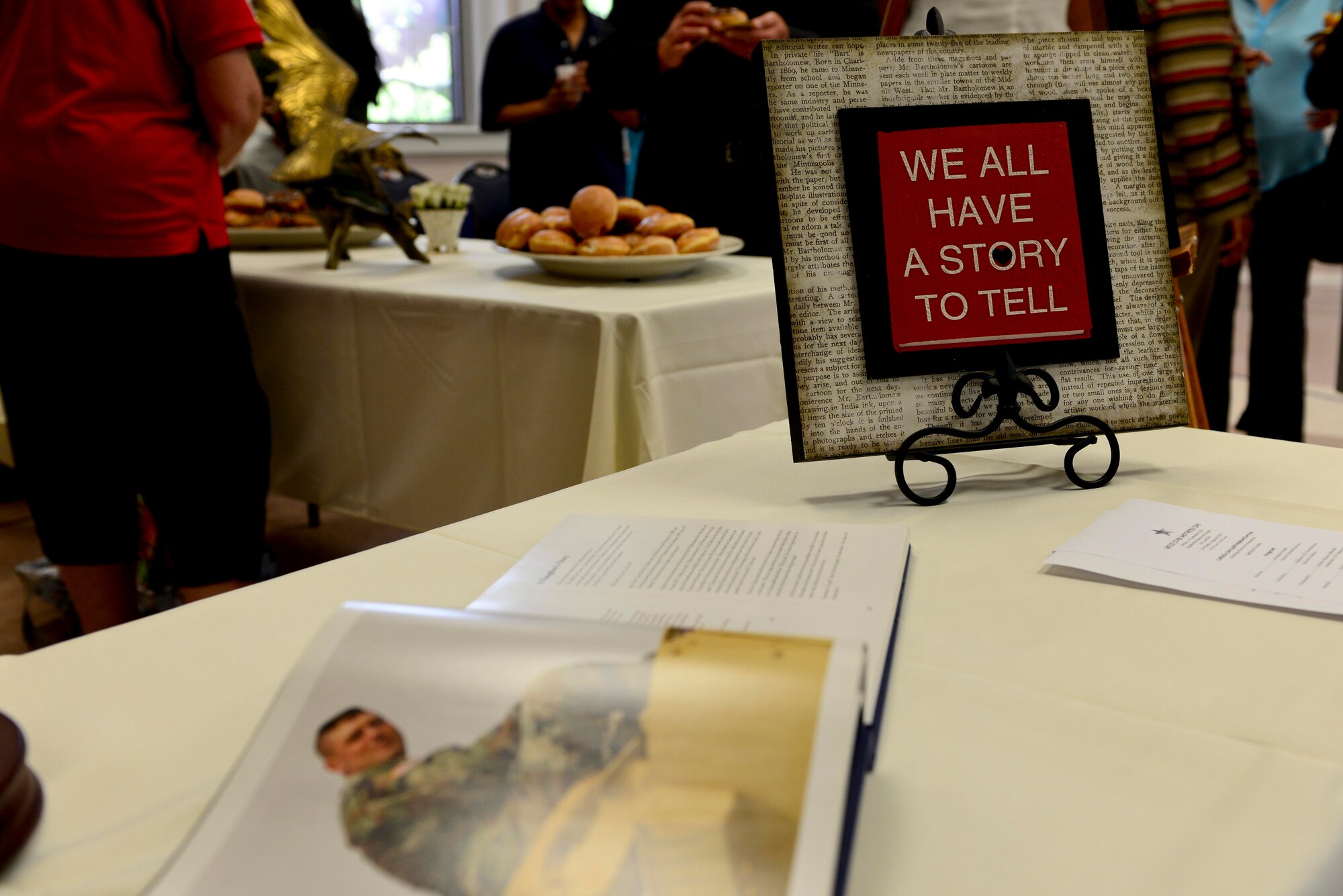 A remembrance table was used to display images of fallen during the Gold Star Mother’s Day ceremony and candle-lighting at the Regimental Memorial Chapel at Fort Eustis, Va., Sept. 28, 2014. The observance day was created in 1936 to honor the mothers of fallen Service members. (U.S. Air Force photo by Airman 1st Class Kimberly Nagle/Released)  