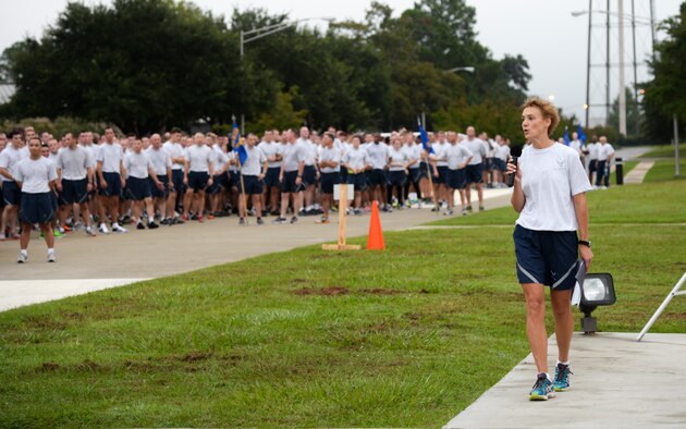 U.S. Air Force Col. Andra Kniep, 23d Wing vice commander, gives closing remarks after a base-wide 2.3-mile run on Comprehensive Airman Fitness Day, Sept. 30, 2014 at Moody Air Force Base, Ga. The focus for CAF day was on the physical pillar and included group discussions about diet and exercise. (U.S. Air Force photo by Senior Airman Sandra Marrero/Released)
