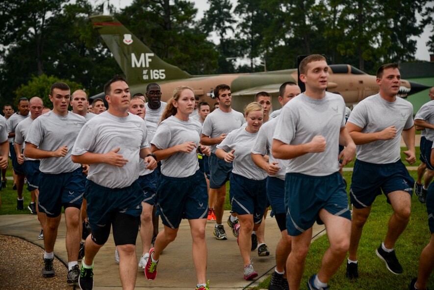 Airmen return to the President George W. Bush Air Park as they complete a 2.3-mile run for Comprehensive Airman Fitness day Sept. 30, 2014, at Moody Air Force Base, Ga. The run was held to emphasize the physical pillar of CAF day. (U.S. Air Force photo by Senior Airman Sandra Marrero/Released) 
