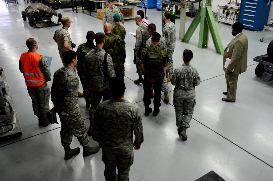 Inspectors from the Conventional Armed Forces in Europe treaty verification team walk through buildings during an exercise at Spangdahlem Air Base, Germany, Sept. 29, 2014. CFE inspections allow foreign countries to conduct an on-site inspection of U.S. installations. The inspections verify that the United States remains in compliance with treaty limits on equipment like tanks, armored-combat vehicles, heavy artillery, combat aircraft and attack helicopters. (U.S. Air Force photo by Airman 1st Class Kyle Gese/Released)