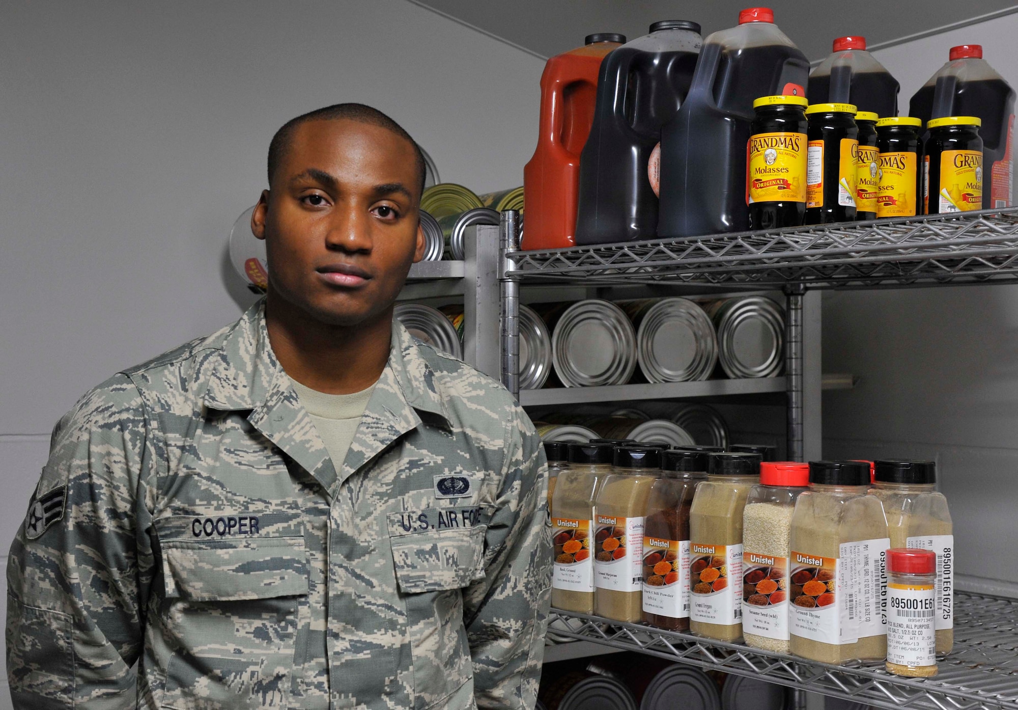 U.S. Air Force Senior Airman DeQuinn Cooper, 35th Force Support Squadron Falcon Feeder store room manager, stands in an inventory room at Misawa Air Base, Japan, Sept. 19, 2014. Cooper’s responsibilities include ordering food items, taking inventory on a computer database and ensuring public health standards are met. Senior Airman DeQuinn Cooper was selected as the 35 FSS Wild Weasel of the Week. (U.S. Air Force photo by Airman 1st Class Patrick S. Ciccarone/Released) 