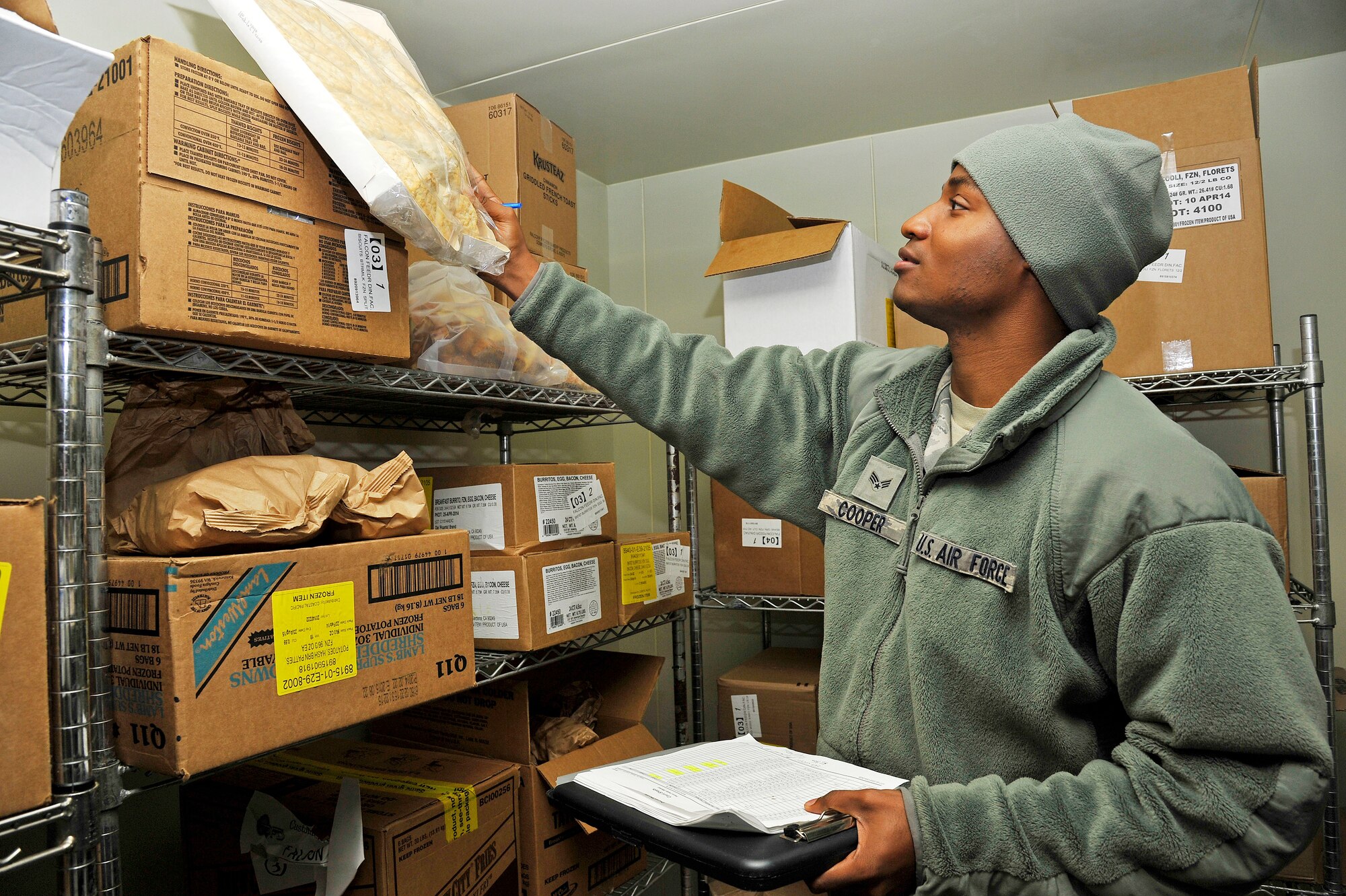 U.S. Air Force Senior Airman DeQuinn Cooper, 35th Force Support Squadron Falcon Feeder store room manager, performs an inventory check at Misawa Air Base, Japan, Oct. 1, 2014. During this process, Cooper individually accounts for each item and enters it into a database for proper record keeping. (U.S. Air Force photo by Airman 1st Class Patrick S. Ciccarone/Released)