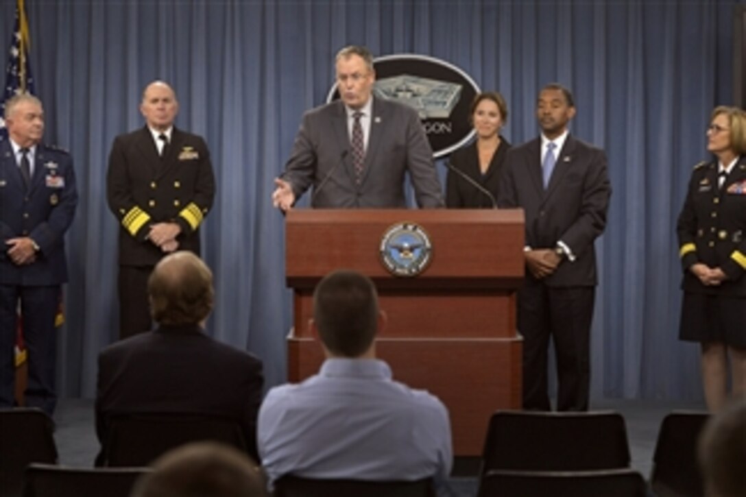 Deputy Defense Secretary Bob Work, flanked by service surgeon generals and other Defense Department health officials, briefs reporters on the Military Health System at the Pentagon, Oct. 1, 2014. 