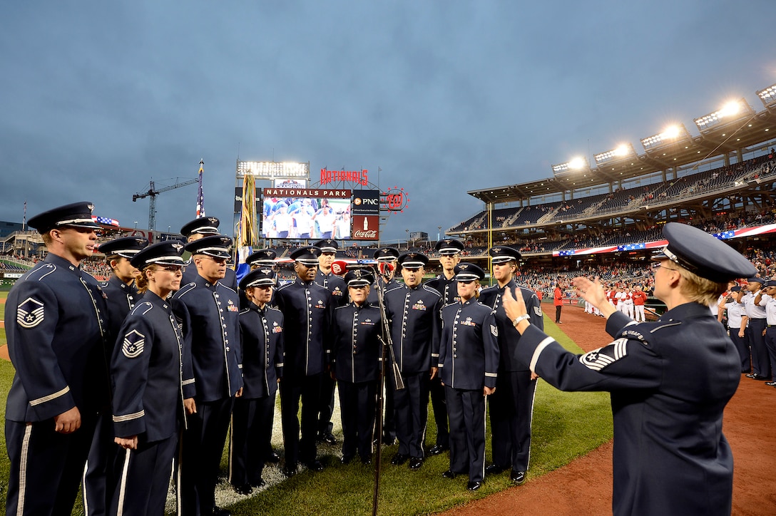 Members of the Air Force Band's Singing Sergeants perform the National Anthem at the Nationals' "Air Force Salute" at Nationals Park, Washington, D.C., Sept. 25, 2014.  The Nationals celebrated the Air Force birthday with Secretary of the Air Force Deborah Lee James throwing the first pitch and Air Force Chief of Staff Gen. Mark A. Welsh III delivering the first ball, and approximately 50 Airmen lined the field to open the game with the New York Mets.  (U.S. Air Force photo/Scott M. Ash)