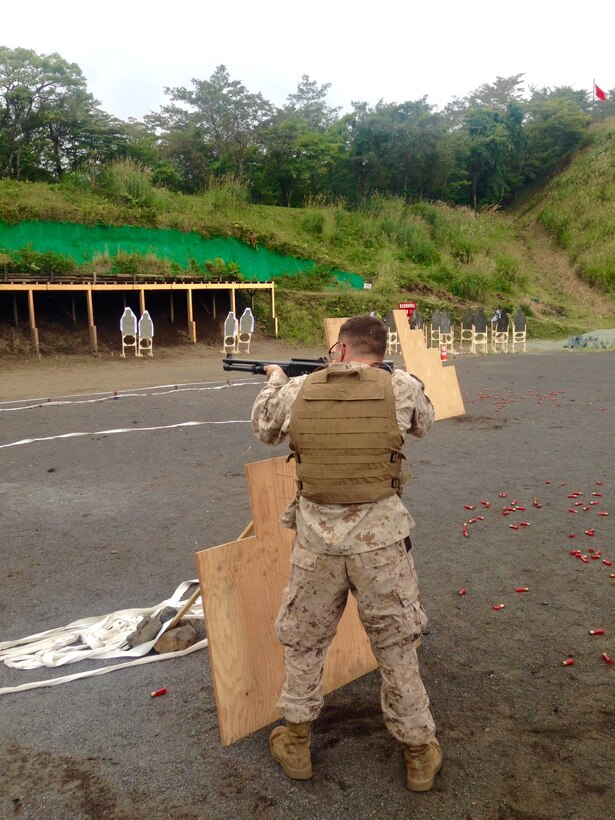 LCpl Jonathan Cribbs, Provost Marshal Clerk, Provost Marshal's Office, Camp Fuji, Japan conducts a Law Enforcement course of fire with the M1014 Joint Service Combat Shotgun. LCpl Cribbs, originally a Motor Vehicle Operator, is currently serving as a Military Policeman in Camp Fuji's Provost Marshal's Office.
