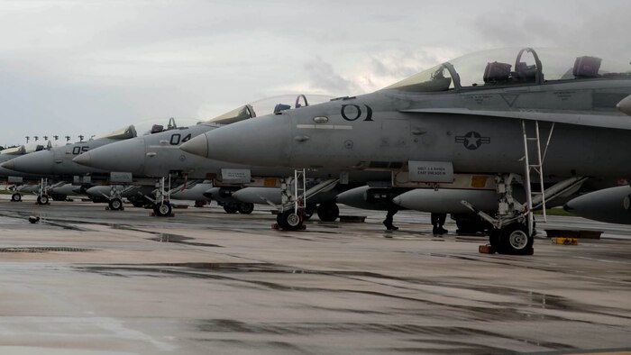 Marine Corps F/A-18 Hornets are parked during Forager Fury III on Andersen Air Force Base Sept. 30. The aircraft are from multiple squadrons and were used in close air support, forward air controller training, air interdiction, air-to-air missions, defensive counter-air and offensive counter-air training events. The overarching training exercise involving 1,300 personnel emphasizes tactical aviation and aviation ground support on a unit level to further develop a distributed, expeditionary combat capability within the Marianas Island range complex. 
