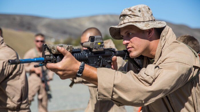 U.S. Marine Sgt. Andy Muller aims in during a dry-fire drill at a close-quarters tactics course aboard Camp Pendleton, Calif., Sept. 25, 2014. Muller is a receiver-transmitter operator with Bravo Company, 1st Reconnaissance Battalion. These Marines are enhancing their skills before compositing with the 15th Marine Expeditionary Unit in October.