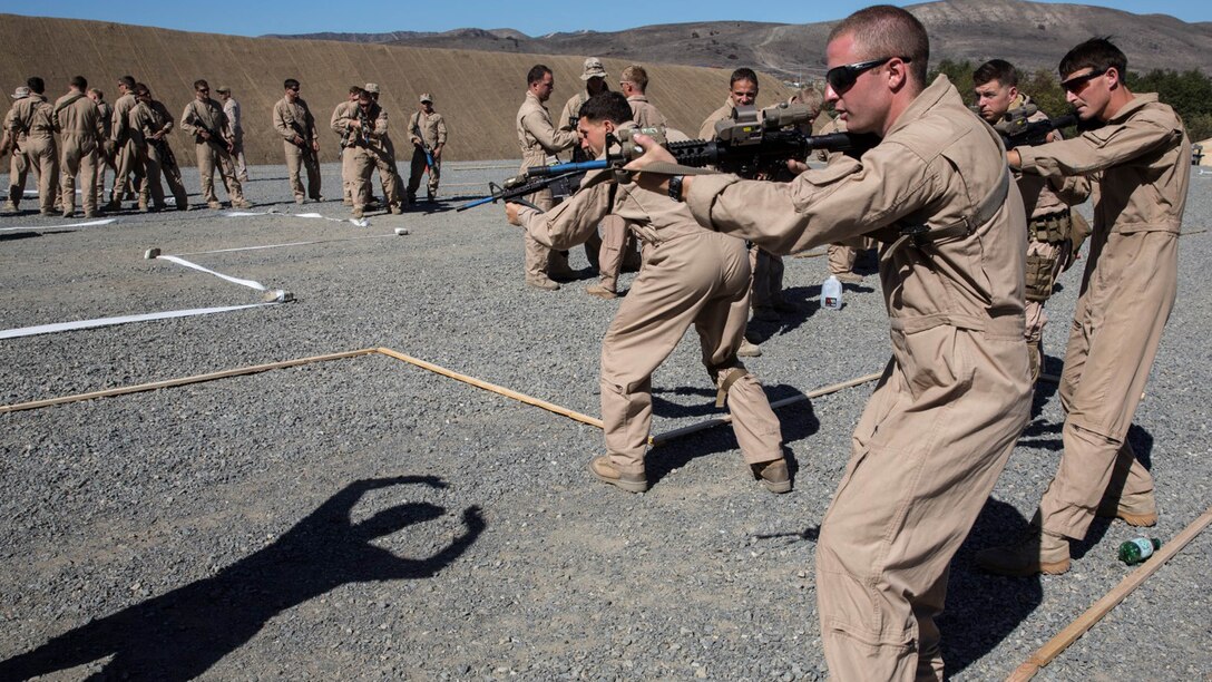 U.S. Marines with Bravo Company, 1st Reconnaissance Battalion, practice clearing rooms during a close-quarters tactics course aboard Camp Pendleton, Calif., Sept. 25, 2014. These Marines are enhancing their skills before compositing with the 15th Marine Expeditionary Unit in October. 