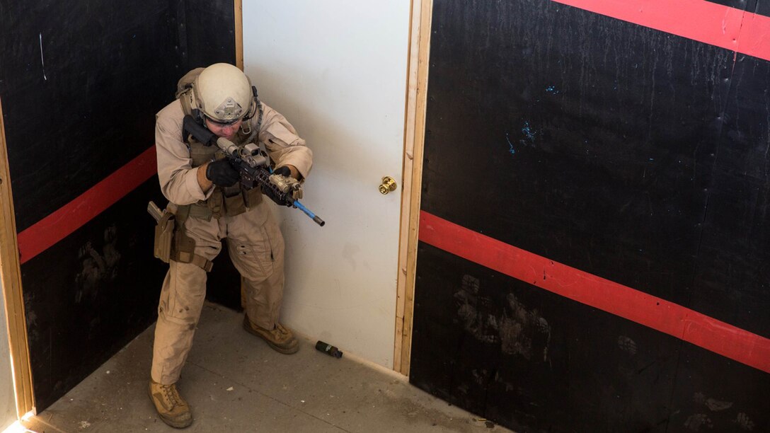 A U.S. Marine with Bravo Company, 1st Reconnaissance Battalion, clears a room during a close-quarters tactics course aboard Camp Pendleton, Calif., Sept. 25, 2014. These Marines are enhancing their skills before compositing with the 15th Marine Expeditionary Unit in October. 