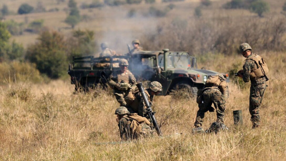 Marines with Black Sea Rotational Force fire an 81mm mortar during a live-fire range at Cincu-14 September 25. The exercise was designed to promote interoperability between both countries with military-to-military training, live-fire ranges, fire support coordination training and sharing tactics, techniques and procedures.