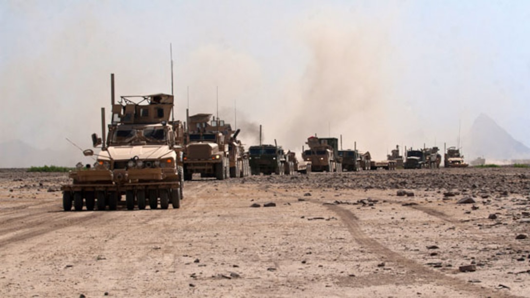 U.S. Marines with Combat Logistics Battalion 8, 2nd Marine Logistics Group (Fwd.) travel in a convoy to the wreckage of a downed French F-2000 Mirage aircraft for a recovery operation northwest of Forward Operating Base Delaram in Helmand province, Afghanistan, May 27, 2011. Marines with the unit assisted French forces in support of International Security Assistance Force operations. (U.S. Marine Corps photo by Staff Sgt. Jeff Kaus/Released)