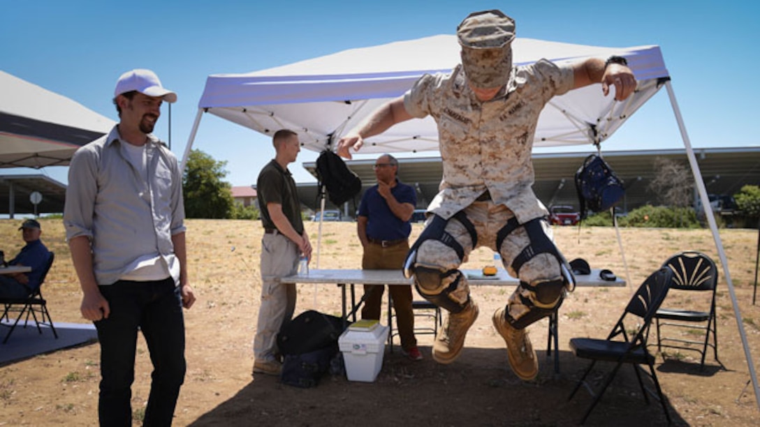 Lance Cpl. Corey Champagne, Field Radio Operator with 3rd Battalion, 12th Marines, 1st Marine Division, tests out Bionic Power's PowerWalk during the Experimental Forward Operating Base here May 14. The PowerWalk is a wearable energy harvester that generates power while walking. ExFOB '14 is taking place May 12-16 and offers Marines the opportunity to come out and evaluate technologies that could possibly be used in the Marine Corps' future. (Official Marine Corps photo by Lance Cpl. Kathy Nunez/released)