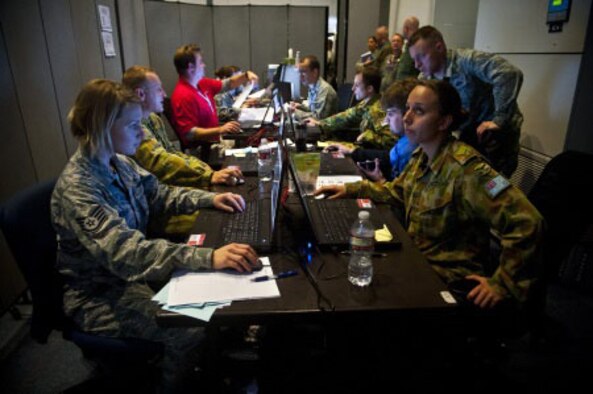The Red Flag 14-1 cyber protection team works on defense procedures inside the Combined Air and Space Operations Center-Nellis during the exercise Feb. 5, 2014, at Nellis Air Force Base, Nev. The CPT's primary goal is to find and thwart potential space, cyberspace and missile threats against U.S. and allied forces. (U.S. Air Force photo/Senior Airman Brett Clashman)