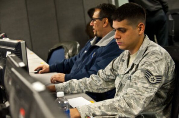 Staff Sgt. Edwin Beltre, 505th Test Squadron intelligence analyst, develops scenarios to use against blue forces as an opposing force team member inside the Combined Air and Space Operations Center-Nellis during Red Flag 14-1, Feb. 5, 2014, at Nellis Air Force Base, Nev. The 505th TS provided the exercise the first use of an Air and Space Operations Center intelligence, surveillance and reconnaissance division to assess current operations and prioritize all ISR assets. (U.S. Air Force photo/Senior Airman Brett Clashman)