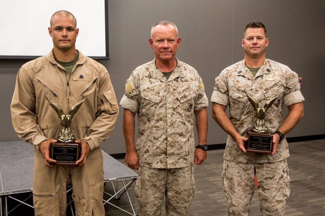 U.S. Marine Sgt. Guy Higgins, left, Maj. Gen. Lawrence D. Nicholson and Gunnery Sgt. Mickey Eaton pose after receiving the Navy and Marine Corps Association Leadership Award aboard Camp Pendleton, Calif., Sept. 26, 2014. Higgins, 27, from Murrieta, Calif., is a sniper for Bravo Company, 1st Reconnaissance Battalion. Nicholson is the Commanding General for 1st Marine Division. Eaton, from Chicago, Ill., is the assistant operations chief for Bravo Co., 1st Recon Bn. (U.S. Marine Corps photo by Cpl. Anna Albrecht/Released)