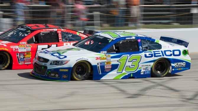 Casey Mears drives the Germain Racing No. 13 GEICO Chevy SS at the 2014 AAA 400, NASCAR Sprint Cup Series, Sept. 28, 2014, at Dover International Speedway in Dover, Del. Dover Air Force Base tail flashes can be seen on the lower quarter panels and the decklid (the rear trunk). (U.S. Air Force photo/Airman 1st Class Zachary Cacicia)