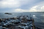 APRA HARBOR, Guam (Oct. 2, 2014) - The aircraft carrier USS George Washington (CVN 73) arrives in Guam for a port visit, which comes after recently taking part in Valiant Shield, a joint U.S. exercise that brought together more than 18,000 service members, 200 aircraft and 19 surface vessels for integrated training in and around Guam. George Washington and its embarked air wing, Carrier Air Wing (CVW) 5, provide a combat-ready force that protects and defends the collective maritime interests of the U.S. and its allies and partners in the Indo-Asia-Pacific.  141002-N-XK455-014
