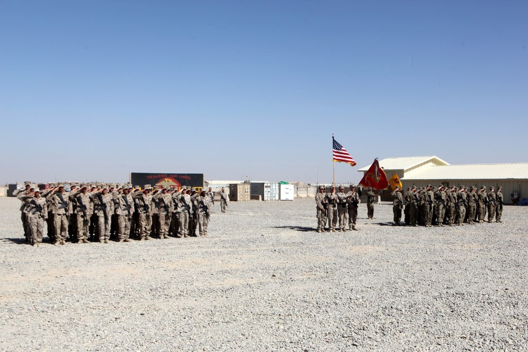 Marines with 1st Battalion, 7th Marines, and soldiers with 3rd Squadron, 3rd Cavalry Regiment, salute while the national anthem is played during a transfer of authority ceremony aboard Tactical Base Dwyer, Afghanistan, Oct. 1, 2014. The ceremony signified the battalion’s transfer of authority of the base and their area of responsibility to 3rd Squadron, a U.S. Army command based out of Fort Hood, Texas. The ceremony also meant the end of combat operations for 7th Marines – a regiment which has been actively supporting Operation Enduring Freedom for several years.