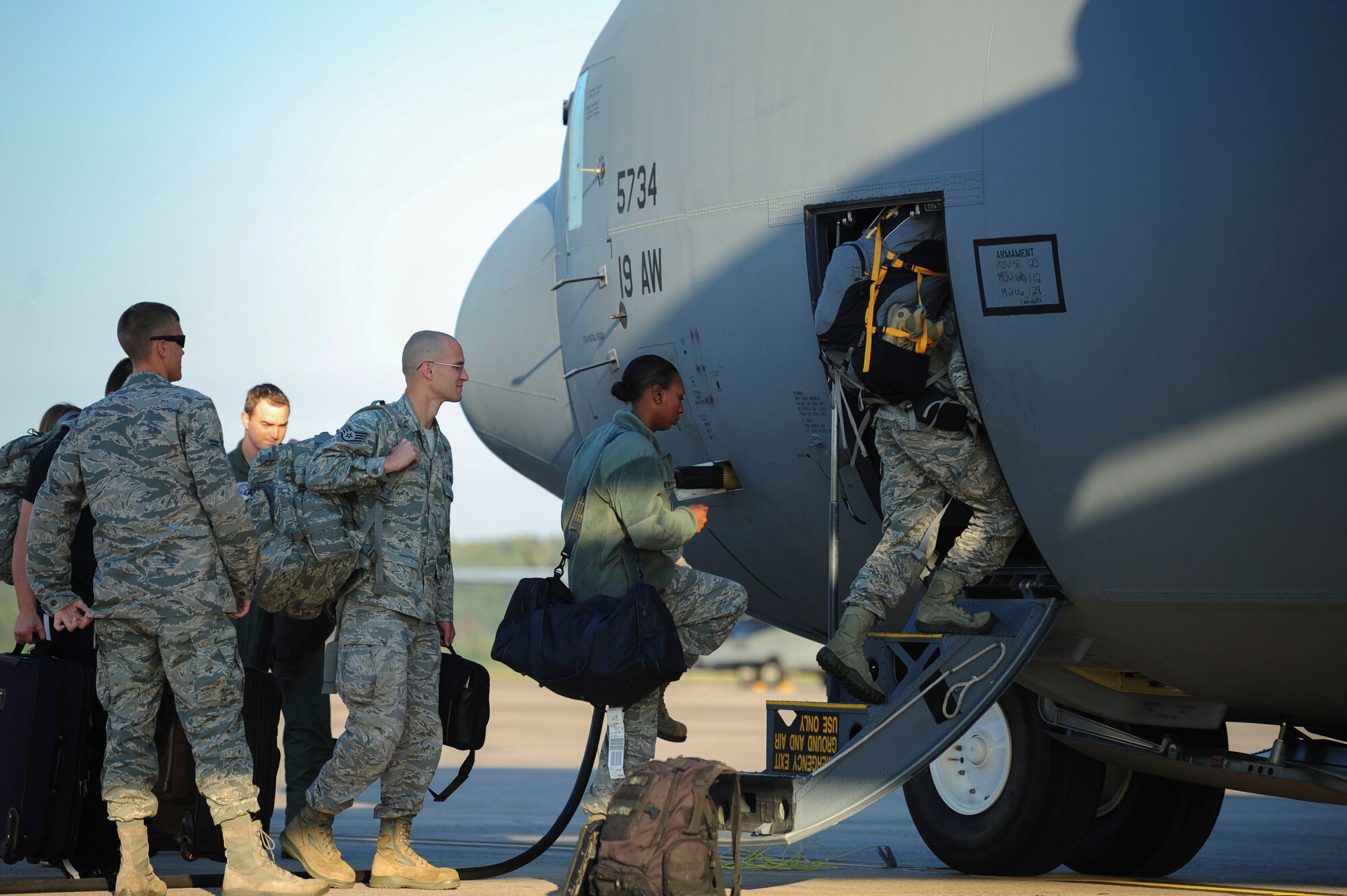 Team Little Rock members board a C-130J for a RED FLAG Alaska exercise Sept. 29, 2014, at Little Rock Air Force Base, Ark. The 19th Airlift Wing sent approximately 90 personnel, including 24 from the 19th Aircraft Maintenance Squadron. Personnel and aircraft from the Republic of Korea, Dobbins Air Reserve Base, Elmendorf Air Force Base and Kunsan Air Base are also participating in the exercise. (U.S. Air Force photo by Senior Airman Kaylee Clark)