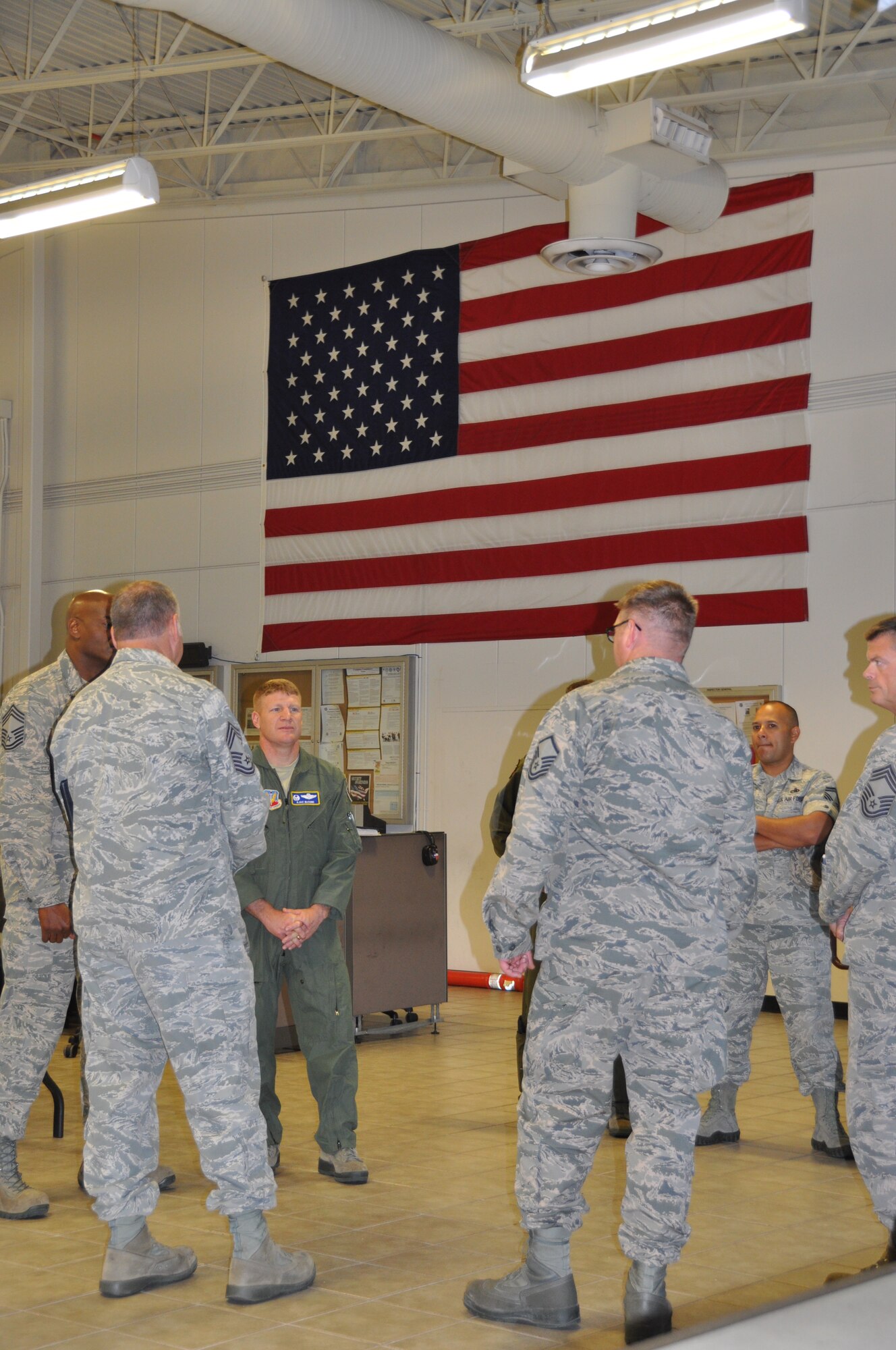 NAVAL AIR STATION FORT WORTH JOINT RESERVE BASE, Texas - Col. James McCune, commander 495th Fighter Group, Shaw Air Force Base, S.C., and the fighter group's superintendent, Chief Master Sgt. Darrel Ford, visit with members of Detachment 457 here during their base visit Oct. 2. The detachment will hold a ceremony tomorrow morning where Lt. Col. Jeffrey Cummingham will assume command. Detachment 457 is an active associate unit of the 301st Fighter Wing. (Air Force photo by Staff Sgt. Jeremy Roman) 