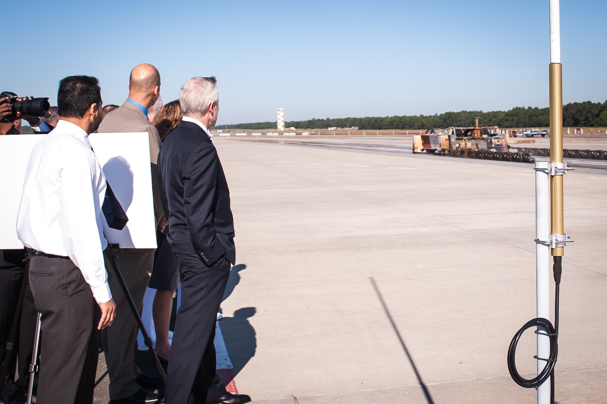 Ray Mabus, Secretary of the Navy, observes dead load launch testing at the NAVAIR Lakehurst electromagnetic aircraft launch systems track during a visit to Joint Base McGuire-Dix-Lakehurst Sept. 26, 2014. (U.S. Air Force photo by Russ Meseroll/Released)