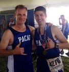 (Left to right) Chaplain (Col) Dondi Costin, Headquarters Pacific Air Forces, Hawaii, and Staff Sgt. Joshua Johnson, Osan Air Base, Republic of Korea, participate in the Air Force Half Marathon, Wright-Patterson Air Force Base, Ohio, Sept. 20, 2014. Dondi and Johnson were part of the Pacific Air Forces team that won 1st place in the half marathon Major Command team challenge. (Courtesy photo from Lois Johnson)
