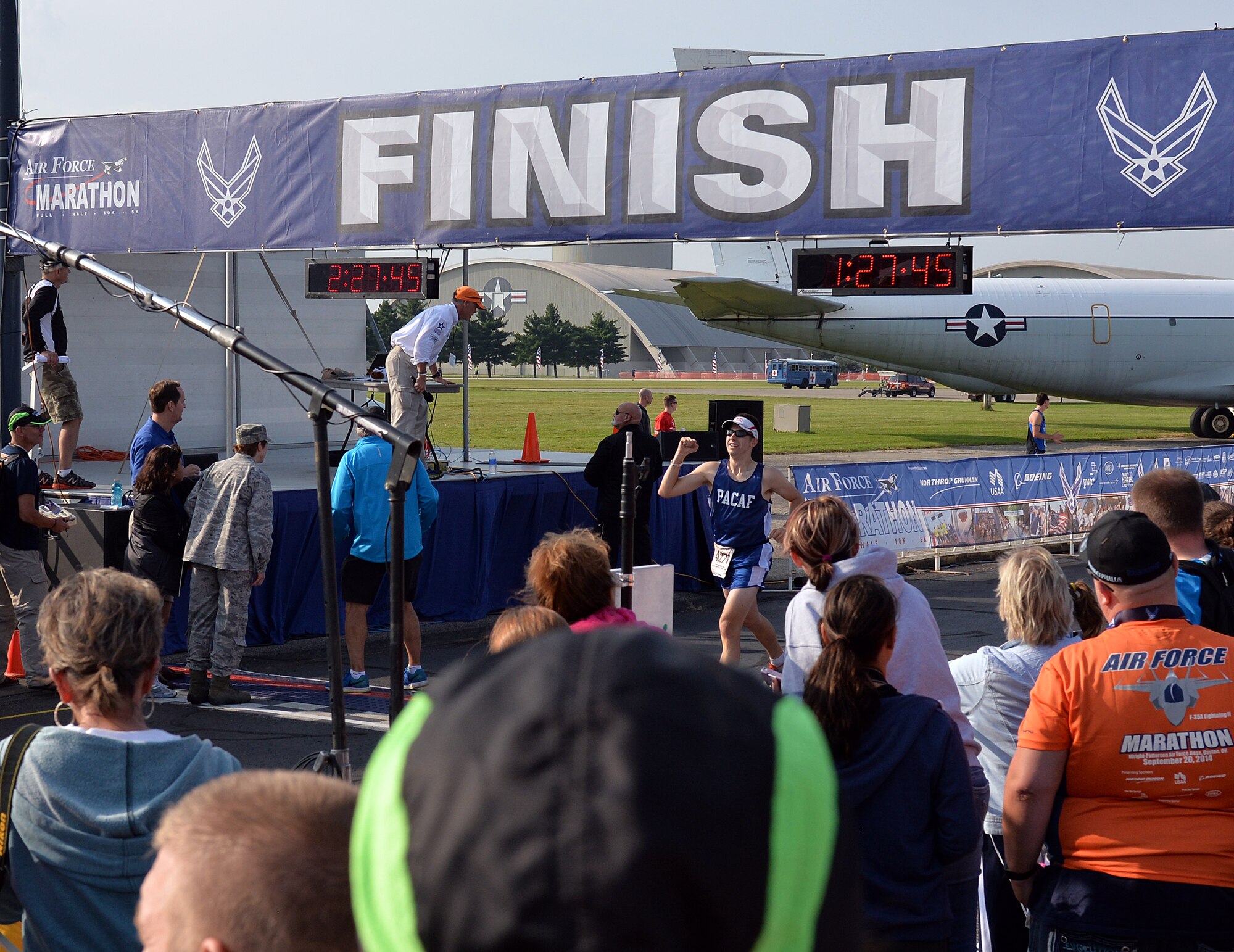 Staff Sgt. Joshua Johnson, Osan Air Base, Republic of Korea, finishes the Air Force Half Marathon, Wright-Patterson Air Force Base, Ohio, Sept. 20, 2014. Johnson was part of the Pacific Air Forces team that won 1st place in the half marathon Major Command team challenge. (Courtesy photo from Lois Johnson)