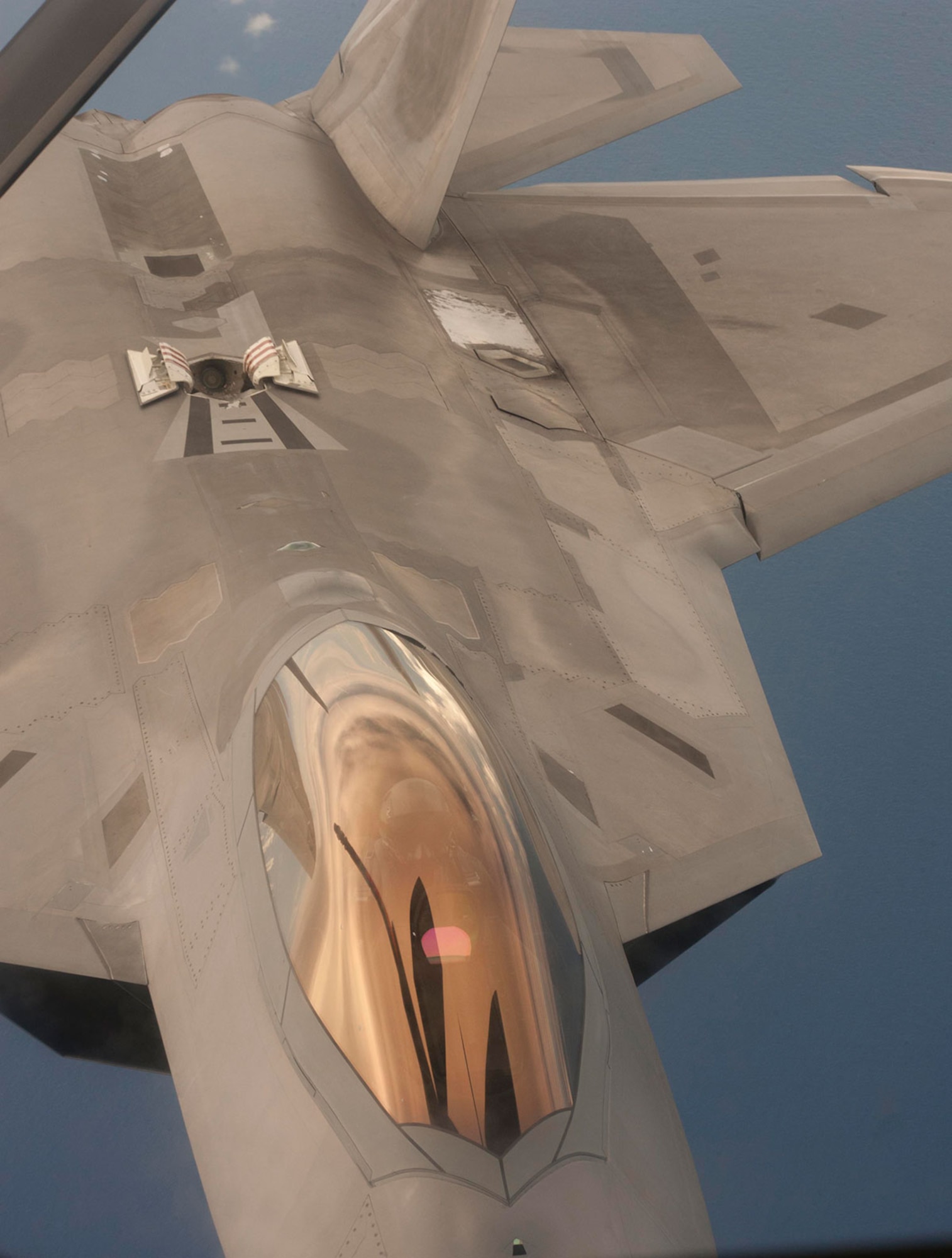PACIFIC OCEAN ( 19 Sept. 2014) -- A U.S. Air Force F-22 Raptor from the 90th Fighter Squadron from Joint Base Elmendorf Richardson prepares to refuel from a KC-135 Stratotanker during exercise Valiant Shield, Sept. 19, 2014.Valiant Shield is a U.S.-only exercise integrating and estimated 18,000 Navy, Air Force, Army and Marine Corps personnel, more than 200 aircraft and 19 surface ships, offering real-world joint operational experience to develop capabilities that provide a full range of options to defend U.S. interests and those of its allies and partners.