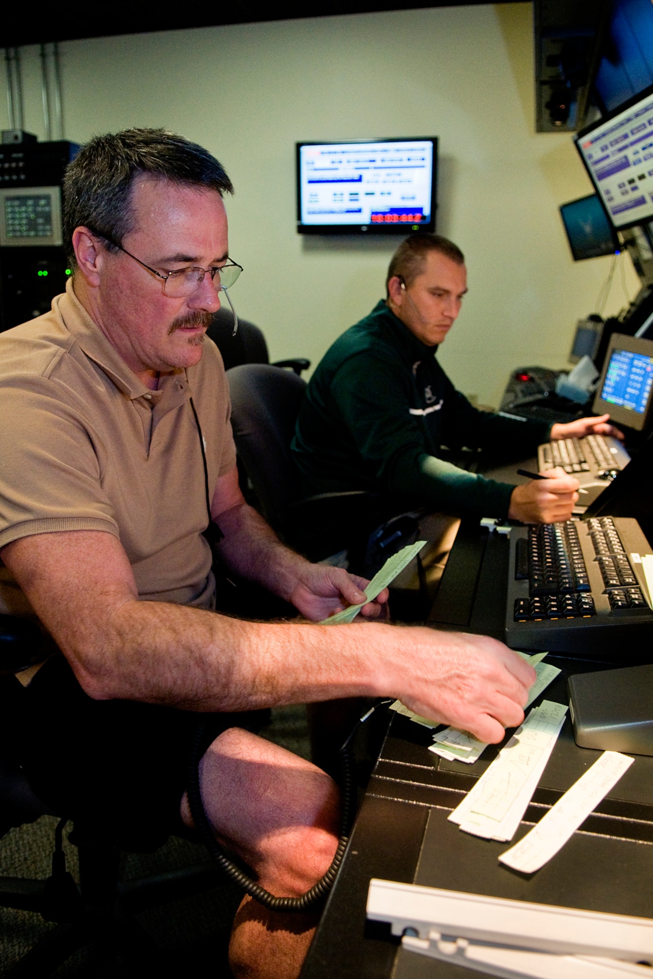 Charles Barrett, left, and Keith Atkinson, both 434th Operations Support Squadron air traffic control specialists manage air traffic at Grissom Air Reserve Base, Ind., Sept. 29, 2014. Grissom ATC normally controls all commercial, civilian and military air traffic up to 10,000 feet between Chicago and Indianapolis, going as far west as Lafayette, Indiana, which is an area of more than 11,000 cubic miles. (U.S. Air Force photo/Mark R. W. Orders-Woempner)
