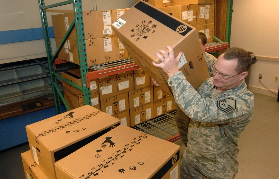 U.S. Air Force Master Sgt. Keith Taylor prepares computers for donation to schools throughout the greater Omaha area Oct. 1 at Offutt Air Force Base, Neb. The computers have been scheduled for replacement and will be donated as part of the Defense Logistics Agency “Computers for Learning” program. Taylor is a client systems technician with the 55th Communications Squadron. (U.S. Air Force photo by Delanie Stafford)
