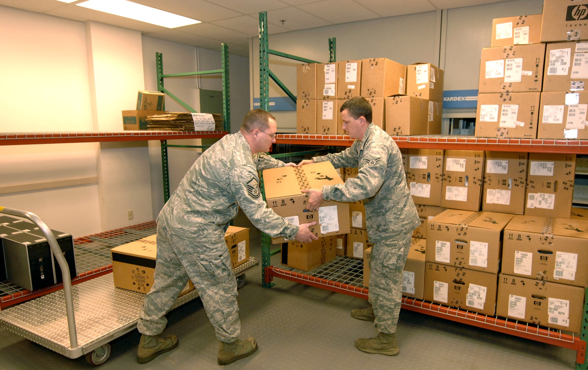 U.S. Air Force Master Sgt. Keith Taylor (left) and Airman 1st Class Joseph Greninger prepare computers for donation to schools throughout the greater Omaha area Oct. 1 at Offutt Air Force Base, Neb. The computers have been scheduled for replacement and will be donated as part of the Defense Logistics Agency “Computers for Learning” program. Taylor and Greninger are client systems technicians with the 55th Communications Squadron. (U.S. Air Force photo by Delanie Stafford)