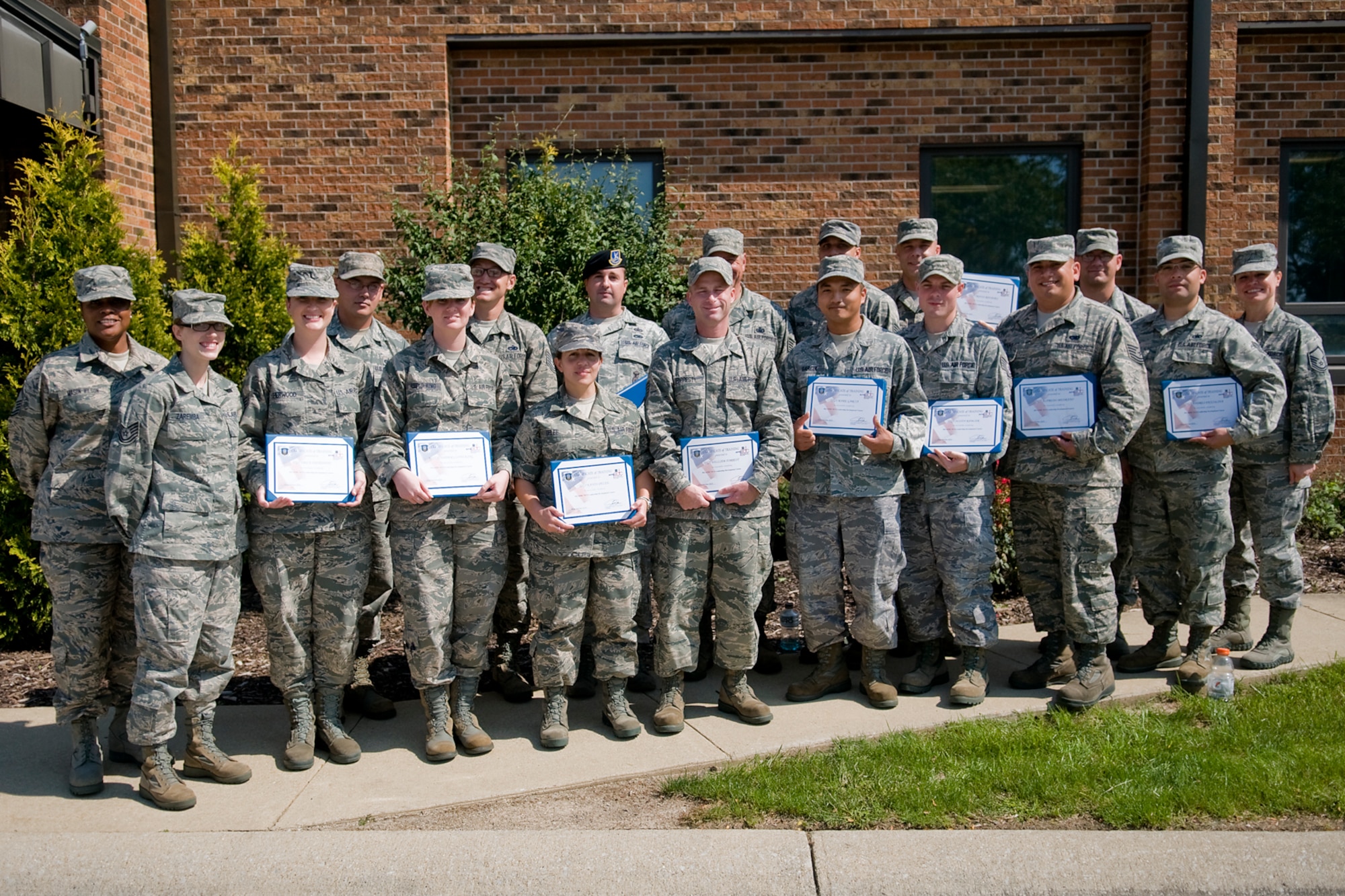 Sixteen graduates of an Air Force Reserve Noncommissioned Officer Leadership Development Course along with their instructors pose for a photo at Grissom Air Reserve Base, Ind., Sept. 19, 2014. The 10-day course combined college level management and leadership instruction with a military practical, experimental and hands-on application. (U.S. Air Force photo/Mark R. W. Orders-Woempner)
