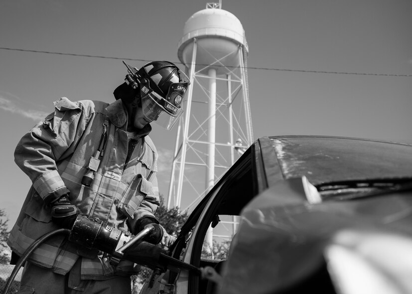 A 96th Test Wing begins cutting the car frame during an extraction training exercise at Duke Field, Fla., Sept. 10.  The day crew of Fire Station 4 took part in the exercise to meet their training requirement.  National Fire Prevention Week began Oct. 5.  Eglin firefighters have various activities planned throughout the week.   (U.S. Air Force photo/Tech. Sgt. Sam King)