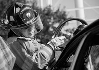 A 96th Test Wing begins cutting the car roof during an extraction training exercise at Duke Field, Fla., Sept. 10.  The day crew of Fire Station 4 took part in the exercise to meet their training requirement.  National Fire Prevention Week began Oct. 5.  Eglin firefighters have various activities planned throughout the week.   (U.S. Air Force photo/Tech. Sgt. Samuel King Jr.)