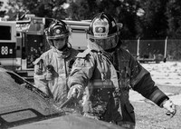 A 96th Test Wing firefighter breaks out the rear car window during an extraction training exercise at Duke Field, Fla., Sept. 10.  The day crew of Fire Station 4 took part in the exercise to meet their training requirement.  National Fire Prevention Week began Oct. 5.  Eglin firefighters have various activities planned throughout the week.   (U.S. Air Force photo/Tech. Sgt. Sam King)