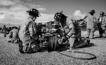 Firefighters from the 96th Test Wing prepare the generator to power cutting tools during a car extraction training exercise at Duke Field, Fla., Sept. 10.  The day crew of Fire Station 4 took part in the exercise to meet their training requirement.  National Fire Prevention Week began Oct. 5.  Eglin firefighters have various activities planned throughout the week.   (U.S. Air Force photo/Tech. Sgt. Sam King)