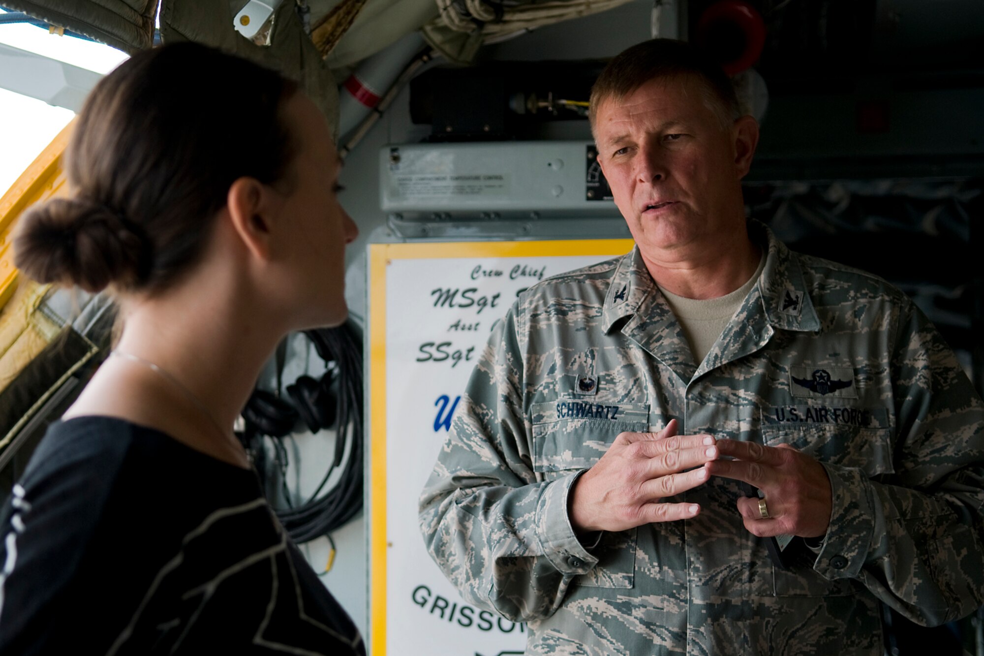 Col. Doug Schwartz, 434th Air Refueling Wing commander, talks with Rachel Lipsey, military legislative assistant for Sen. Joe Donnelly, onboard a KC-135R Stratotanker at Grissom Air Reserve Base, Ind., Sept. 4, 2014. Lipsey toured the north-central Indiana base to learn more about the Air Force Reserve and its mission. (U.S. Air Force photo/Mark R. W. Orders-Woempner)
