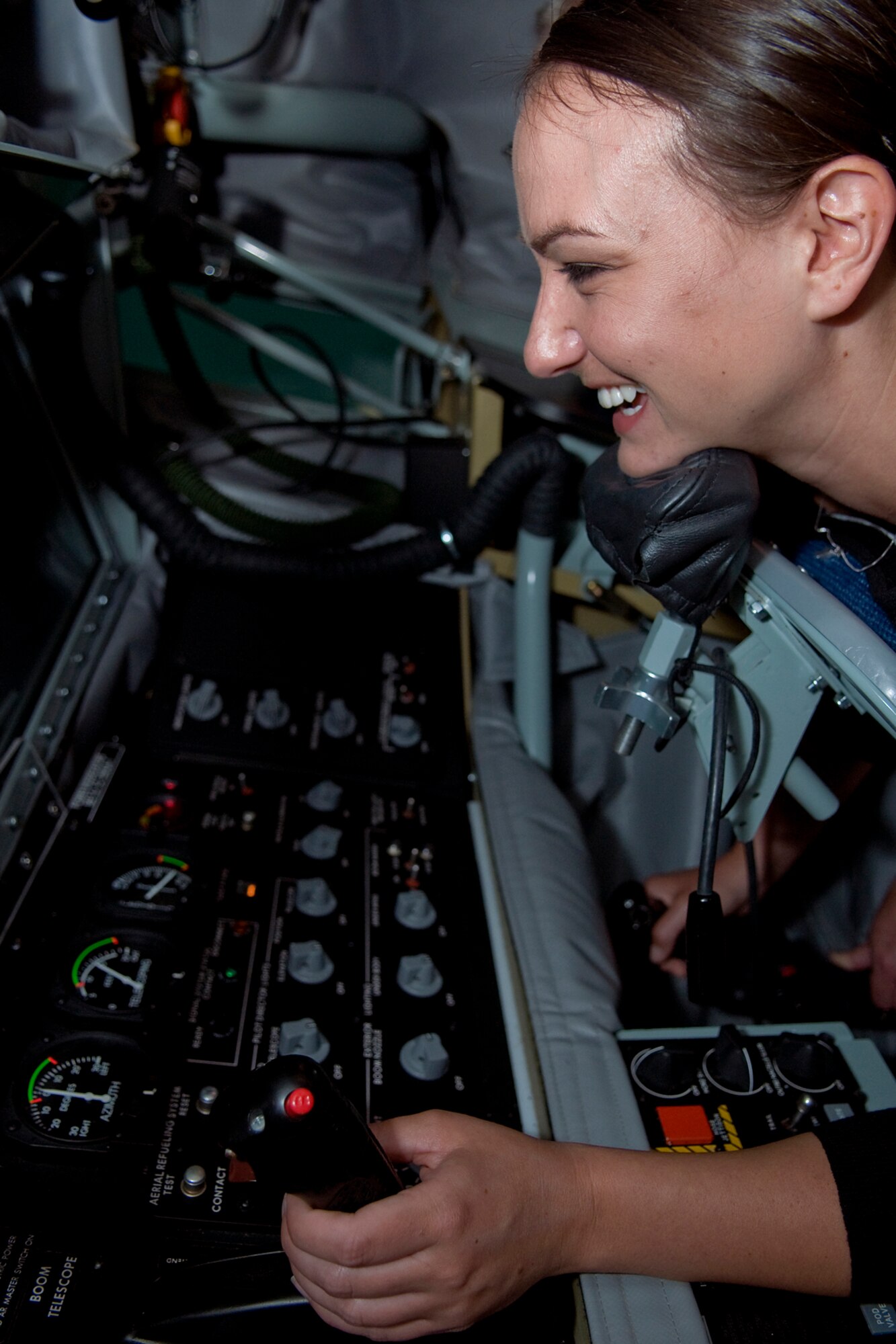 Rachel Lipsey, military legislative assistant for Sen. Joe Donnelly, takes a shot at refueling a simulated F-22 Raptor in a KC-135R Stratotanker boom operator weapons system trainer at Grissom Air Reserve Base, Ind., Sept. 4, 2014. Lipsey toured the north-central Indiana base to learn more about the Air Force Reserve and its mission. (U.S. Air Force photo/Mark R. W. Orders-Woempner)