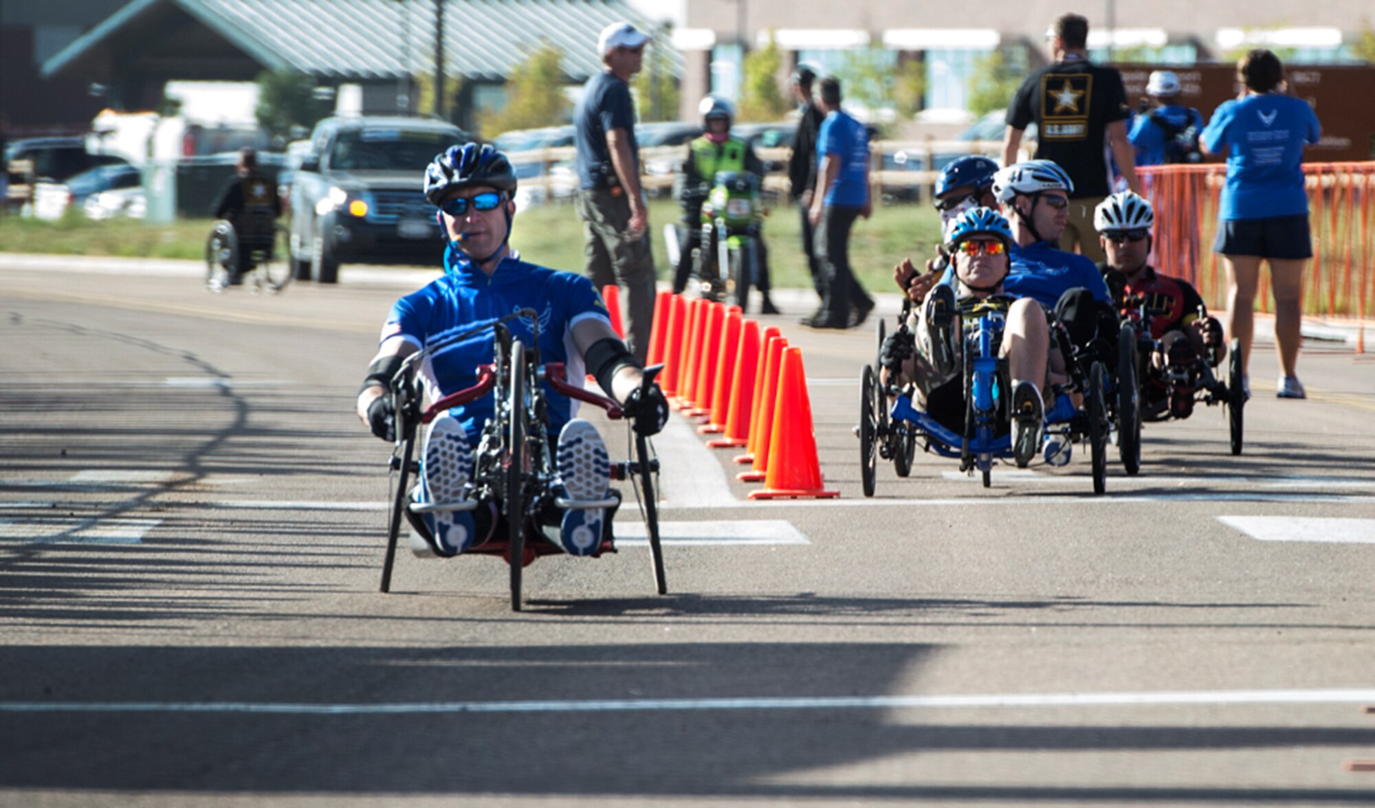 Former Senior Airman Jeremiah Means crosses the finish line at the Warrior Games cycling event Sept. 29, 2014, at Fort Carson, Colorado. Means competed in the hand-cycling heat taking eighth place in his category. (U.S. Air Force photo/Senior Airman Jette Carr)