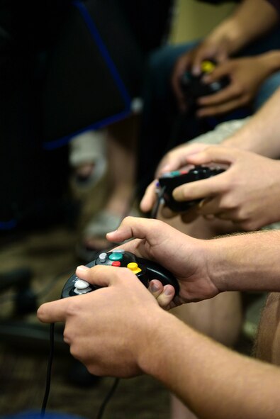 Dorm residents compete in a video game tournament held by the base dormitory council Sept. 28, 2014 at Moody Air Force Base, Ga. The base dormitory council has previously hosted other events for residents such as cookouts and a pool parties. (U.S. Air Force photo by Senior Airman Sandra Marrero/Released)
