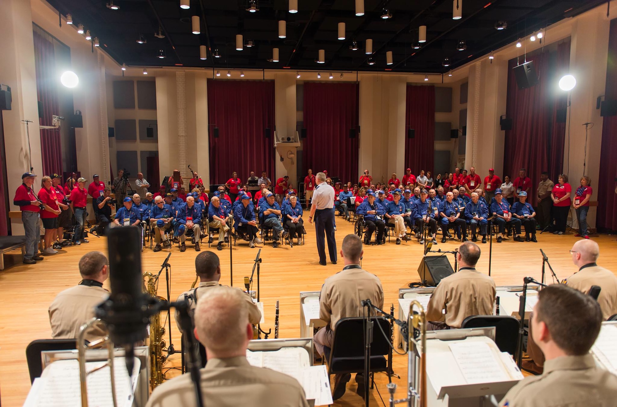 Colonel Larry Lang talks with members of Honor Flight DFW during a special performance of WWII big band music by the Airmen of Note.  The distinguished group of 41 WWII veterans from all the armed services includes many Purple Heart and Bronze Star recipients, one Flying Cross, as well as one POW who received 4 Purple Hearts and a Silver Star. (U.S. Air Force Photo/released)