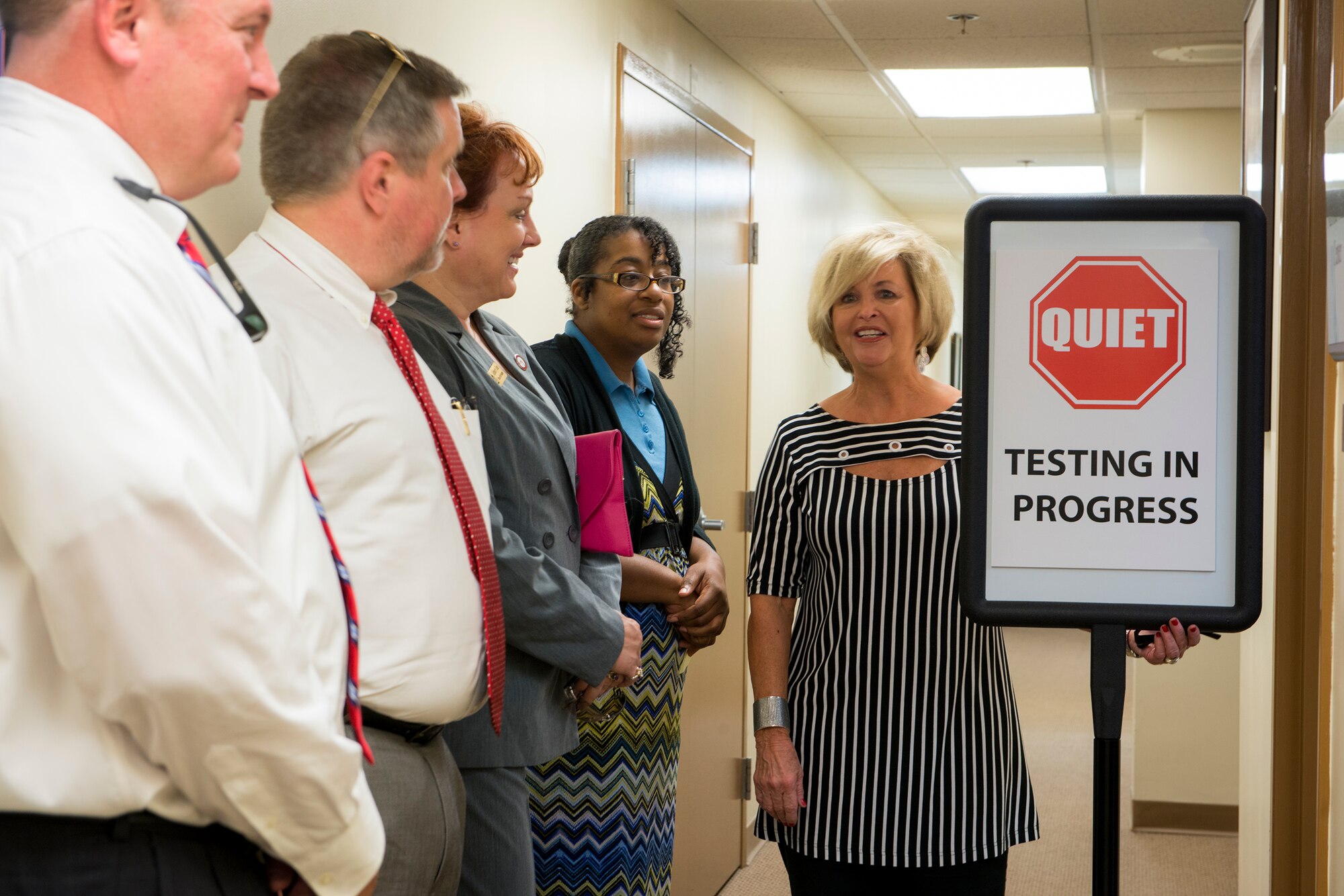 Margaret Brogdon, Wiregrass Georgia Technical College offsite coordinator, gives a tour of the education center  to local college presidents Sept. 18, 2014, at Moody Air Force Base, Ga. The presidents visited base to learn how to better tailor their college programs for Airmen. (U.S. Air Force photo by Airman 1st Class Ryan Callaghan/Released)