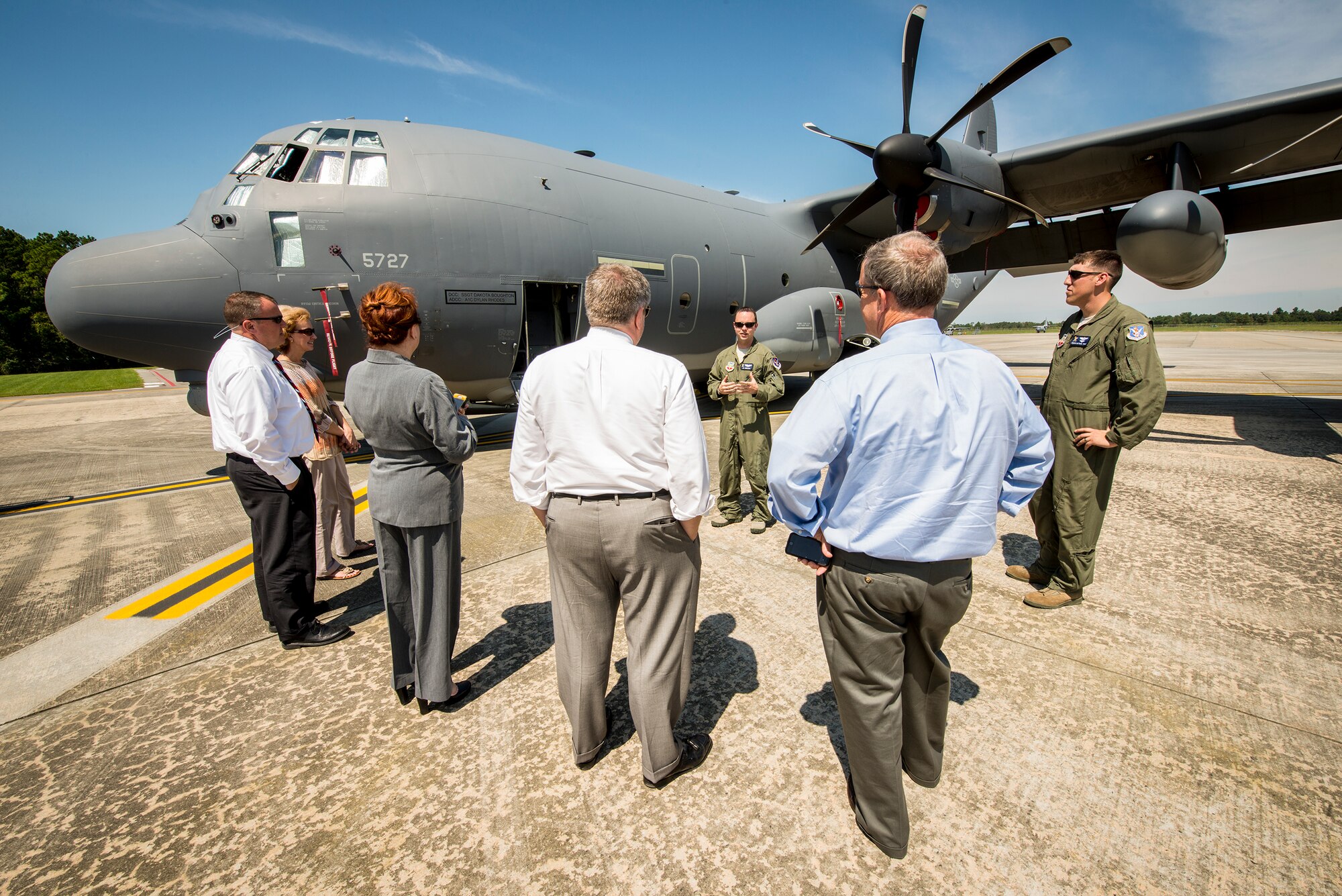 U.S. Air Force Capt. J.D. Corless, 71st Rescue Squadron HC-130J Combat King II pilot, briefs the aircraft’s capabilities to local college presidents during a base tour Sept. 18, 2014, at Moody Air Force Base, Ga. During their tour, the presidents visited the dorms, the education center and the flightline. (U.S. Air Force photo by Airman 1st Class Ryan Callaghan/Released)