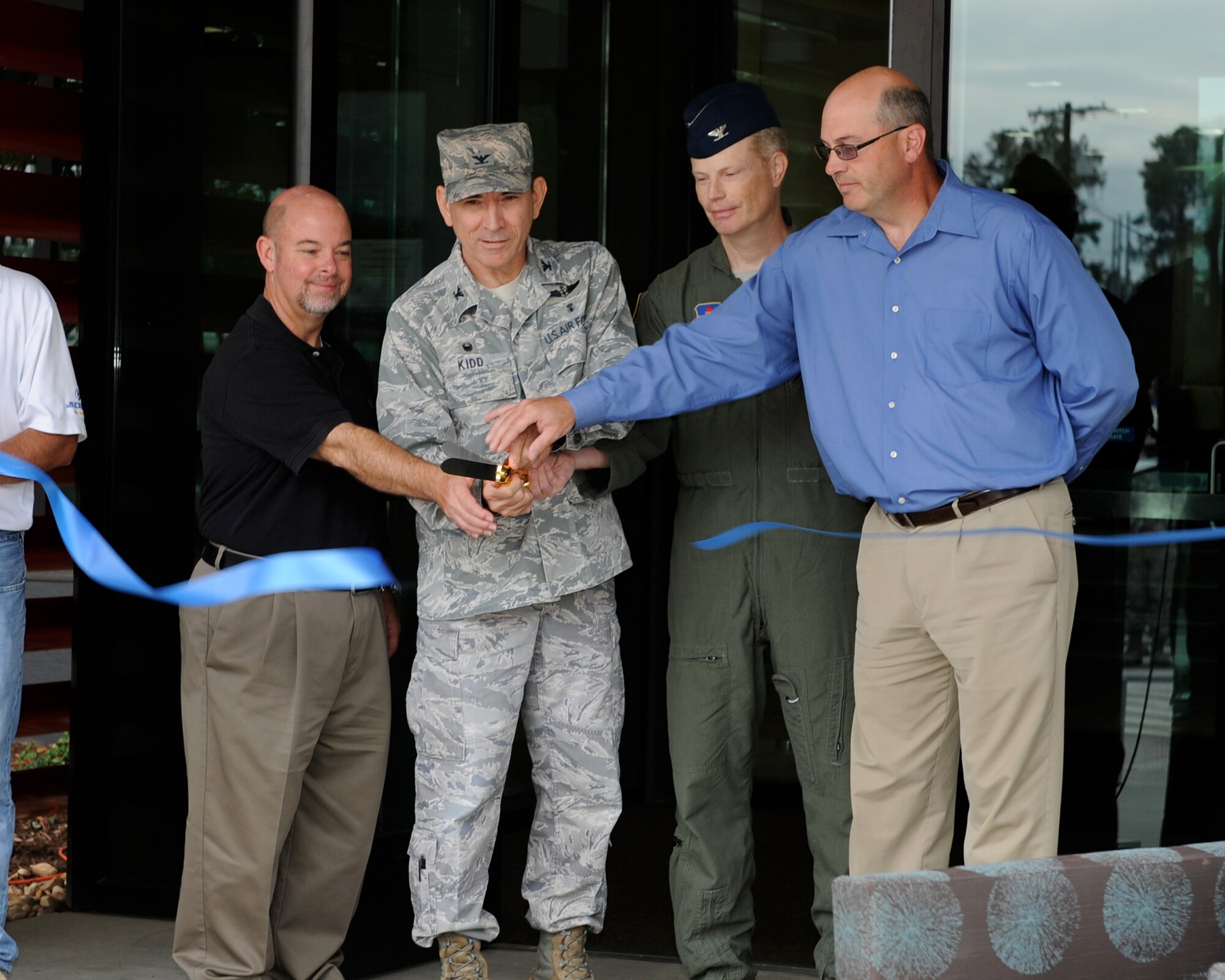 Mark Brightwell, U.S. Army Corps of Engineers Project Manager; Col. Allen Kidd, 14th Medical Group Commander; Col. Howard McArthur, 14th Flying Training Wing Vice Commander; and Craig Stearns, JE Dunn Construction lead contractor, cut the ribbon for the opening of the 14th MDG Koritz Clinic Oct. 2. The ribbon cutting marked the completion of Phase I of a two-phase renovation of the Koritz Clinic. (U.S. Air Force photo/ Elizabeth Owens)