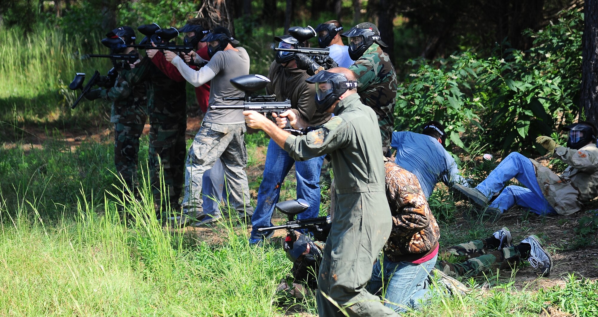 Members of the 49th Fighter Training Squadron play paintball in a squadron-wide paintball event on Columbus Air Force Base Sept.  30 at the end of the fiscal year.Morale-raising events are conducted by the Air Force and by squadrons regularly to ensure the well-being of Airmen. (U.S. Air Force Photo/Airman Daniel Lile)