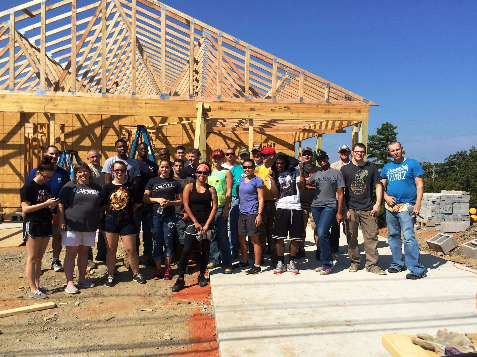 Team Little Rock members volunteer for Habitat for Humanity Sept. 20, 2014, in North Little Rock, Ark. To get information on volunteer opportunities call the Airmen and Family Readiness Center at (501) 987-2667, contact your unit’s booster club, or reach out to a base organization such as the Rising 6, Top III or the Company Grade Officer Council. (Courtesy photo) 