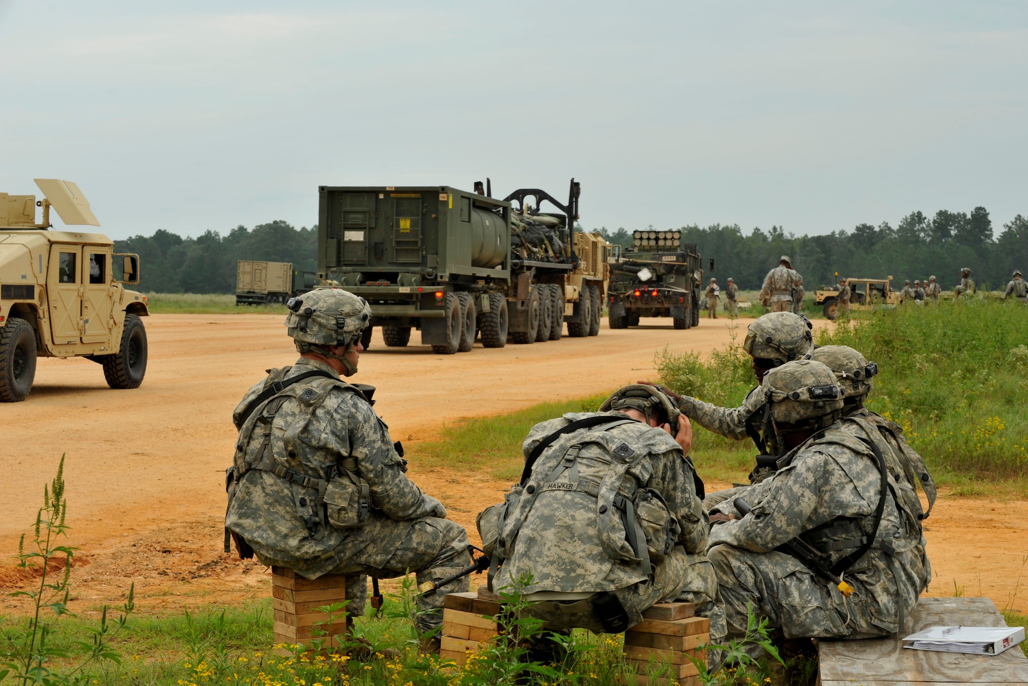 An arrival and departure control group keeps an account of what is brought onto the airfield Sept. 18, 2014, at the landing zone at Fort Polk, La. The A/DACG can spend approximately 72 hours on post to make sure that these trucks are processed accurately. (U.S. Air Force photos by Senior Airman Regina Agoha)